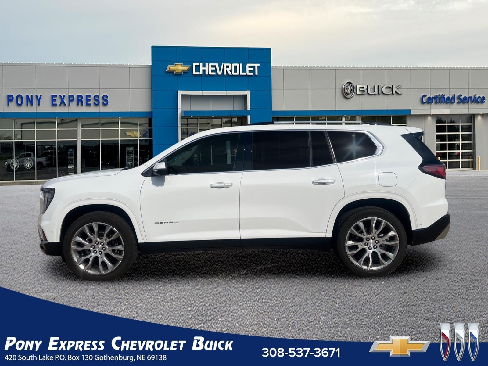 2026 GMC Acadia Denali in Summit White — front three-quarter view