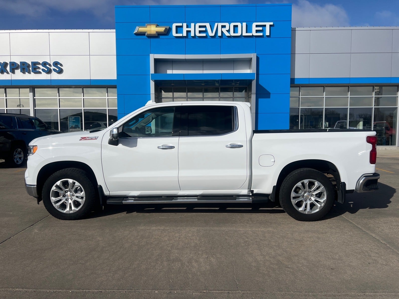 2025 Chevrolet Silverado 1500 LTZ in Summit White — front three-quarter view