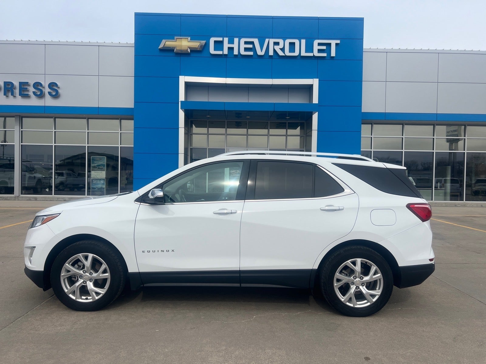2021 Chevrolet Equinox Premier in Summit White — front three-quarter view