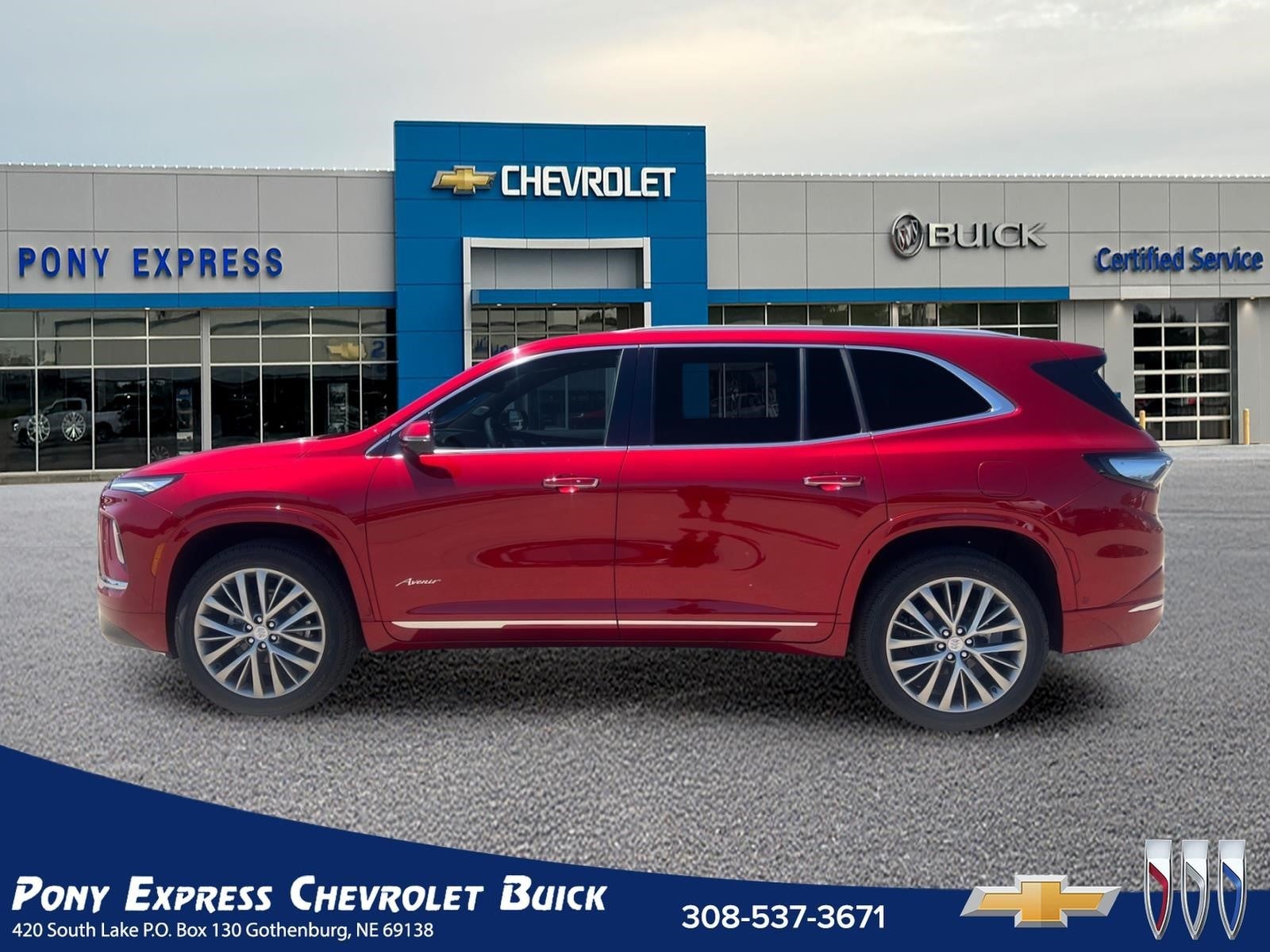 2026 Buick Enclave Avenir in Cherry Red Tintcoat — front three-quarter view