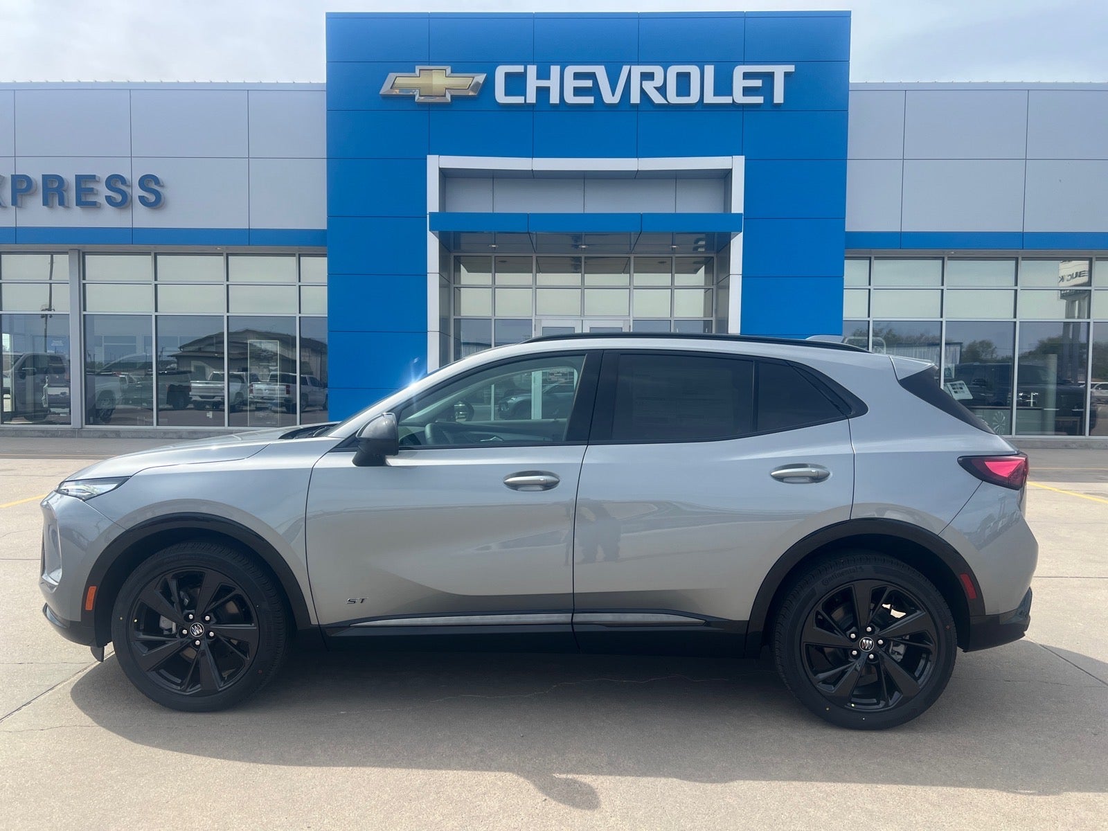 2026 Buick Envision Sport Touring in Moonstone Gray Metallic — front three-quarter view