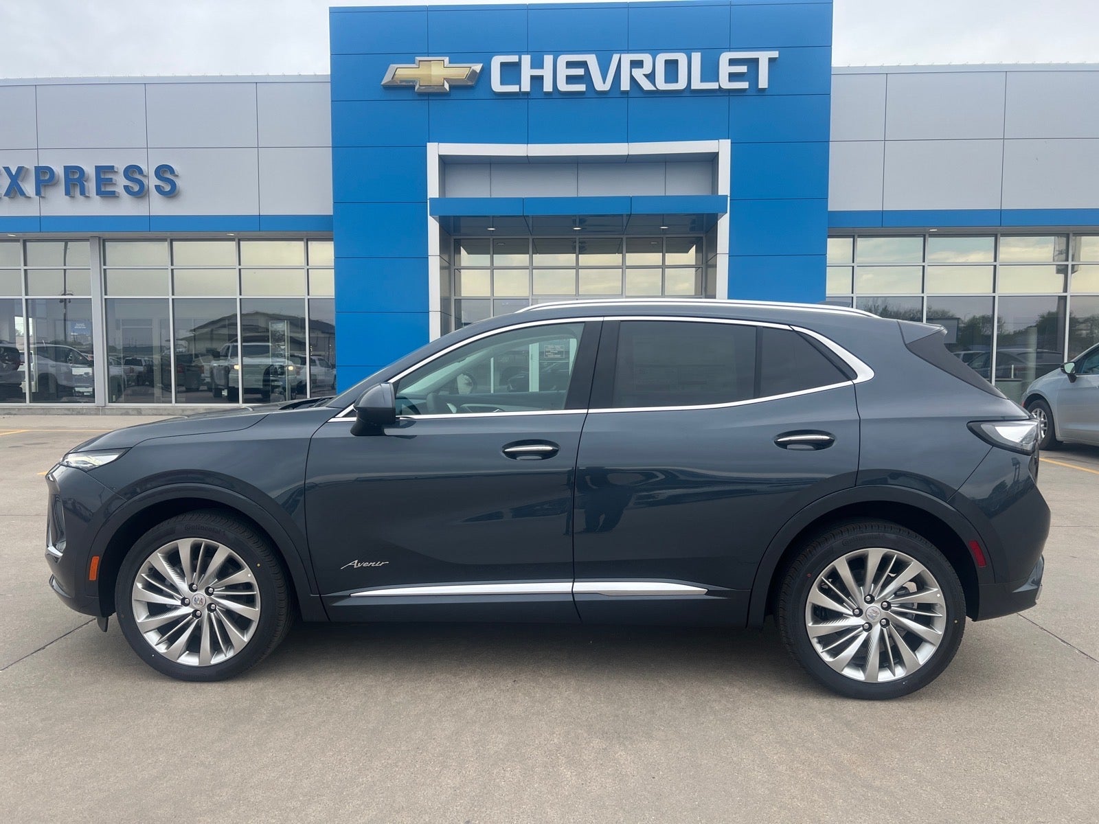 2026 Buick Envision Avenir in Quartz Blue Metallic — front three-quarter view